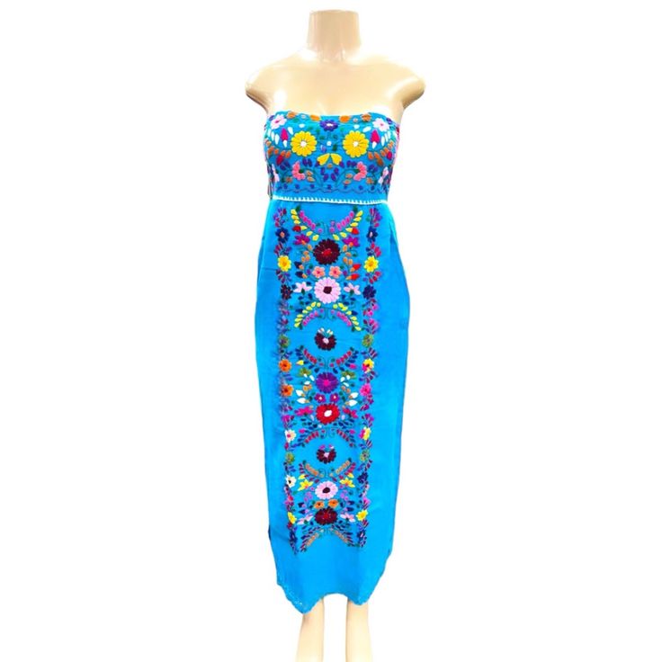 Experience Elegance And Authenticity In The Sara Mexican Strapless Dress! This Beautiful Dress Features A Traditional Mexican Floral Design Encased In A Modern Strapless Style Made With Fine Mexican Cotton. Uniquely Finished With Elastic On The Back For A Perfect Fit And Hand Embroidered Flowers And Knit Details, It's Sure To Make You Stand Out In The Crowd! Get Yours Now And Shine With Unique Mexican Style! Blue Strapless Summer Dress, Blue Sundress Maxi Dress For Parties, Blue Strapless Dress For Summer Evenings, Blue Long Bohemian Dress, Bohemian Sleeveless Light Blue Midi Dress, Blue Strapless Maxi Dress For Summer, Bohemian Light Blue Sleeveless Midi Dress, Light Blue Strapless Sundress, Strapless Blue Midi Dress For Beach