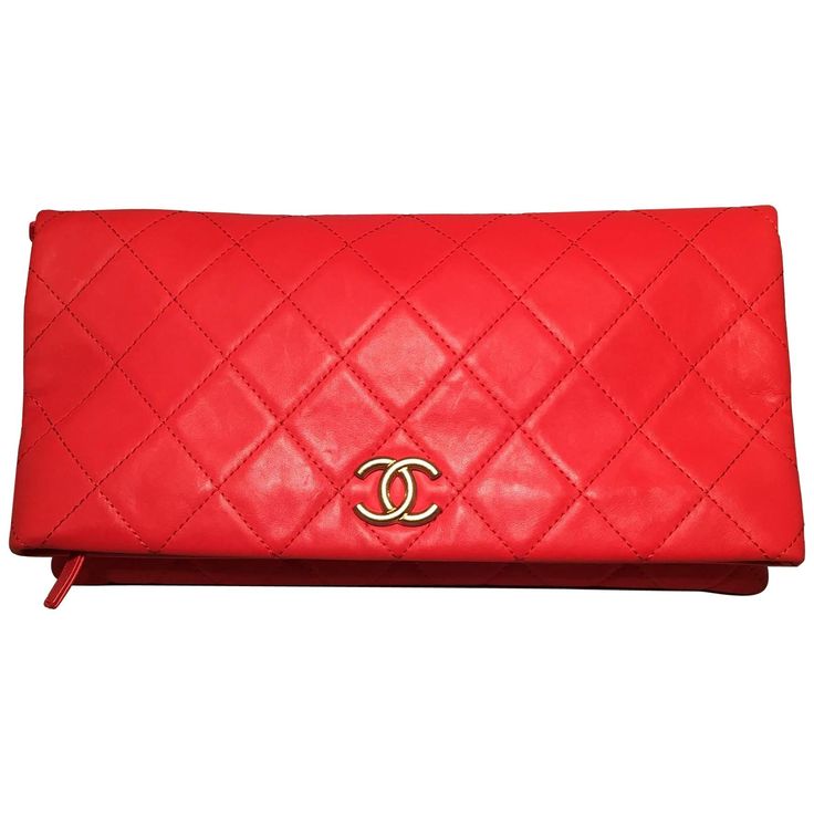 Chanel Red Quilted Leather CC Fold Over Clutch in excellent condition. Bright red quilted leather exterior trimmed with matte gold CC logo hardware along front top fold. Two interior zippered compartments lined with red nylon. No stains, smells or exterior scuffs. Clean corners and edges. Purchase includes a dust cover and authenticity card. Measurements: 14"x7.5" Chanel Reissue, Card Measurements, Chanel Clutch, Fold Over Clutch, Red Clutch, Red Quilts, Vintage Clutch, Chanel Bags, Chanel Black