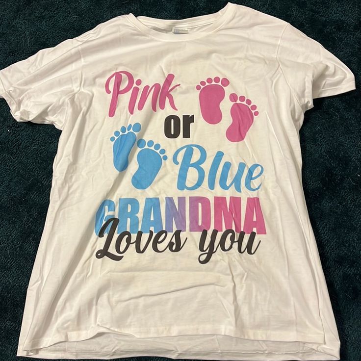 a white shirt with pink or blue grandma loves you written on the front and bottom