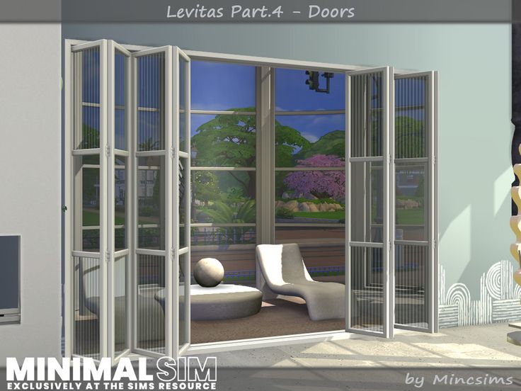 a living room with an open glass door