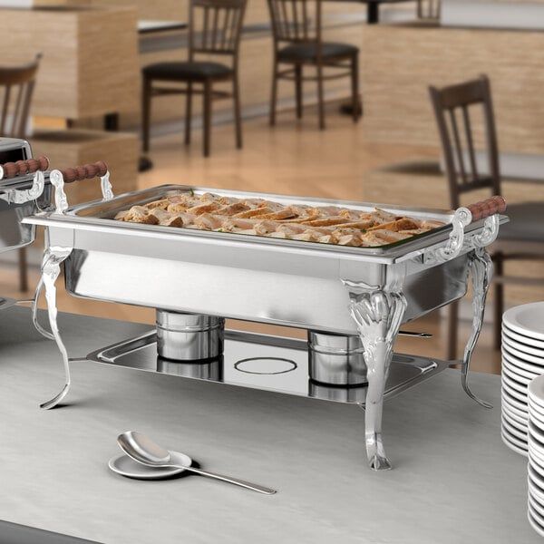 a buffet table with silverware and food on it