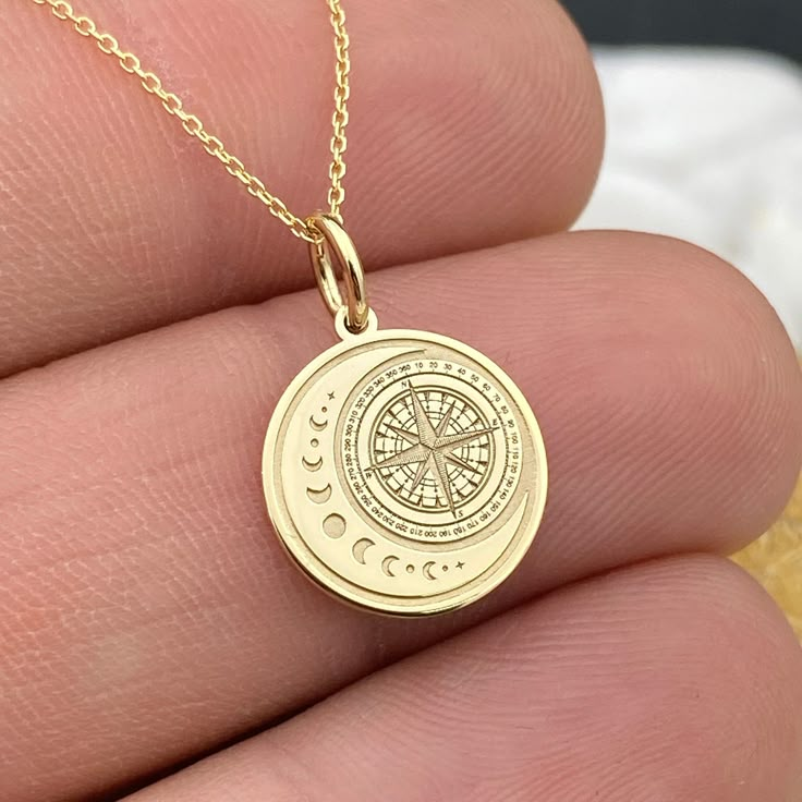 Dainty 14k Solid Gold Moon Compass Pendant, Personalized Moon Compass Necklace, Compass Moon Charm, Moon Necklace, Compass Gift 14k Solid Gold Choose What Size You Want the Pendant Using The First Option Box Choose If you Want Thinner, Thicker  Or Without Chain Using The Second Option Box Photos Are For The 0.5 inch Diameter Pendant Pendant thickness : 0.5mm  Contact us if you want it thicker Inner diameter of jump ring : 4mm Contact us if you need it bigger              No1 chain width : 0.87mm Luxury Elegant Medallion Necklace For Gift, Cheap Medallion Necklace For Gift, Luxury Elegant Necklace With Moon Phase, Gold Moon Jewelry, Celestial Coin Necklace With Moon Charm, Celestial Round Coin Necklace With Moon Charm, Celestial Compass Design Round Necklaces, Moon Phase Coin Necklace As Gift, Round Yellow Gold Charm Necklaces With Moon Phase