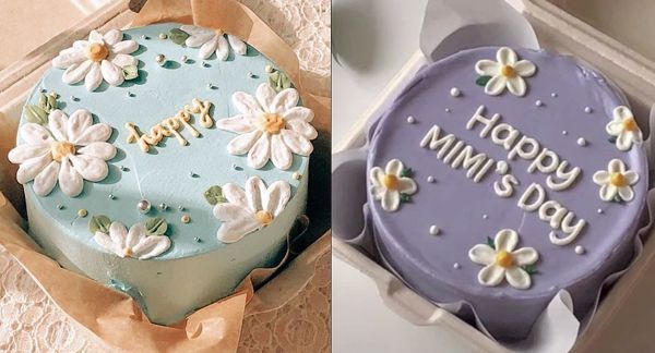 two cakes decorated with flowers and the words happy birthday