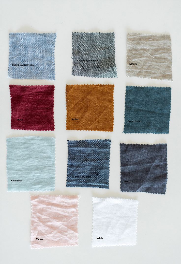 several different colors of fabric on a white surface