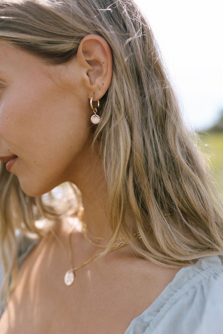 Celebrate life’s journey with our collection of earthy and elegant Botanicals. These handcrafted Botanical Drop Earrings are hand stamped with 7 different florals to help you tell your beautiful story of growth and change. - 15mm 14k Gold-Filled hoops - 14K Gold Filled Pendant (9 mm) with hand stamped botanical - Custom, hand drawn Botanical stamps illustrated by local tattoo artist - Handcrafted with love from San Clemente, California 14k Gold Filled Huggie Matching Earrings, Everyday 14k Rose Gold Filled Jewelry, Minimalist 14k Gold Filled Birth Flower Jewelry, Feminine Dangle Jewelry For Everyday, Nature-inspired Single Earring As A Gift, Nature-inspired Single Earring As Gift, Single Earring Nature-inspired Jewelry As Gift, Feminine Everyday Gold Earrings, Elegant Everyday Birth Flower Earrings