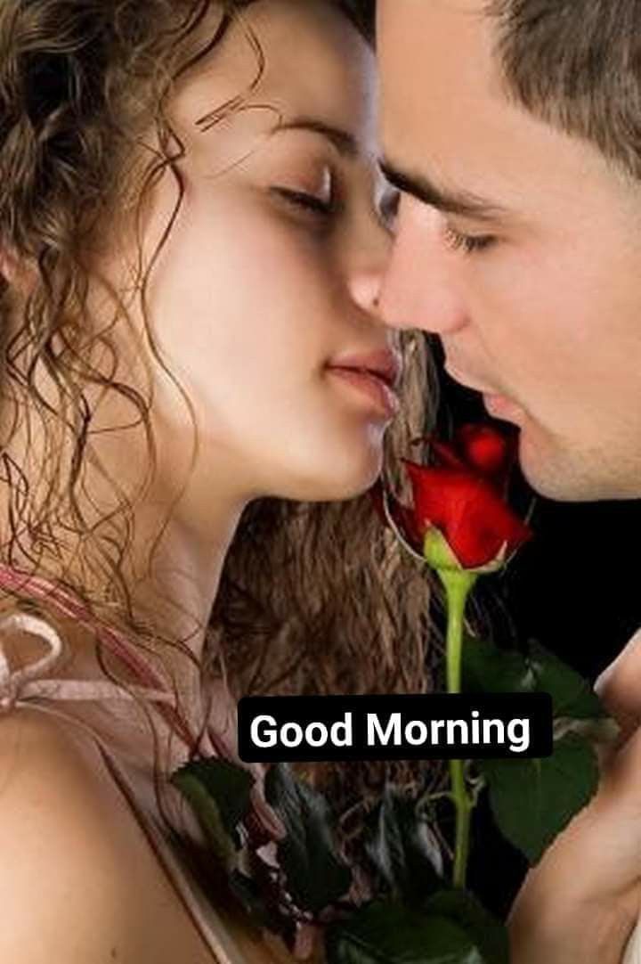 a man kissing a woman with a rose in her hand and the words good morning written on it