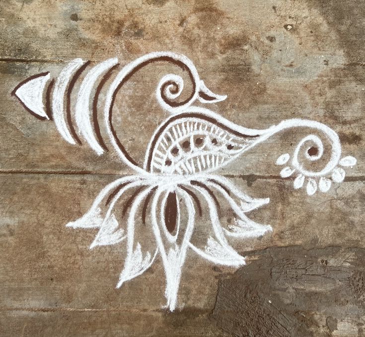 an artistic drawing on the side of a wooden wall