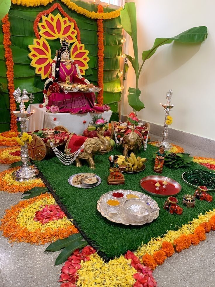 there is a small shrine with food on the ground and decorations around it in bright colors