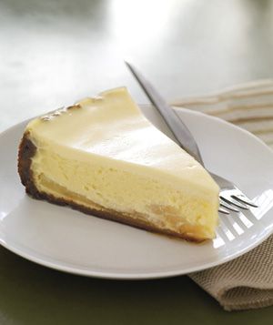 a piece of cheesecake on a plate with a fork