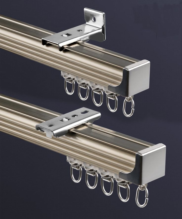 two stainless steel curtain rails with hooks attached to them