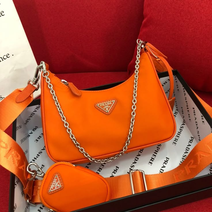 Orange Prada Bag, Prada Re Edition 2005, Concert Bags, Expensive Bag, Trendy Purses, Prada Re Edition, Unique Handbag, Luxury Bags Collection, Aesthetic Bags