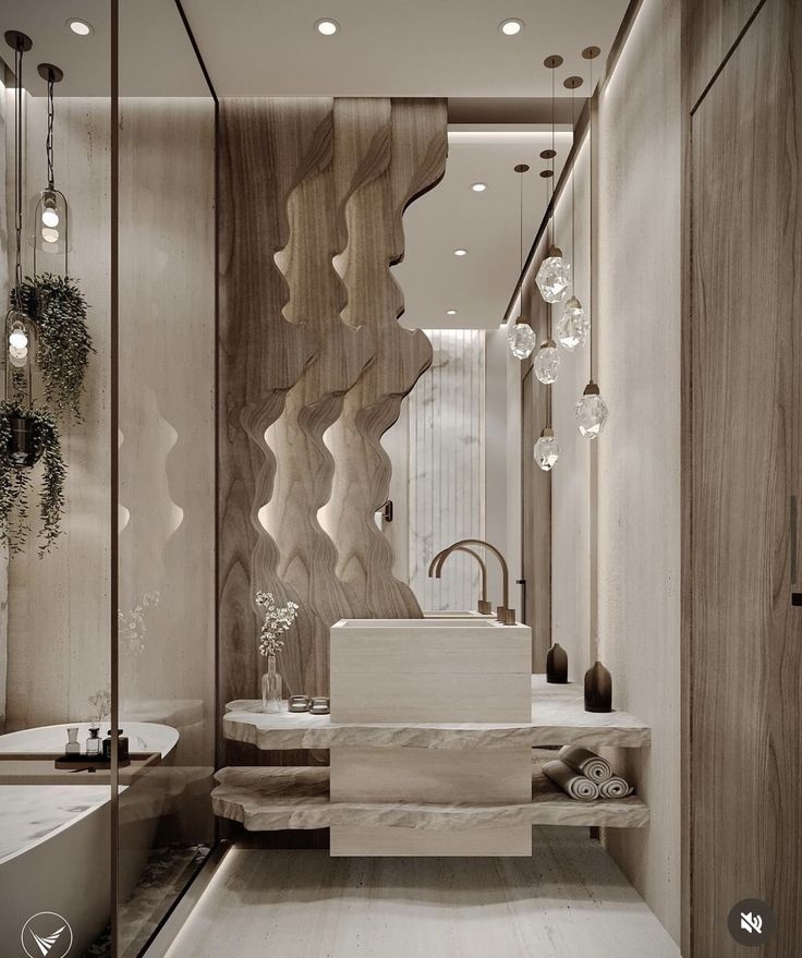 an elegant bathroom with marble and wood accents