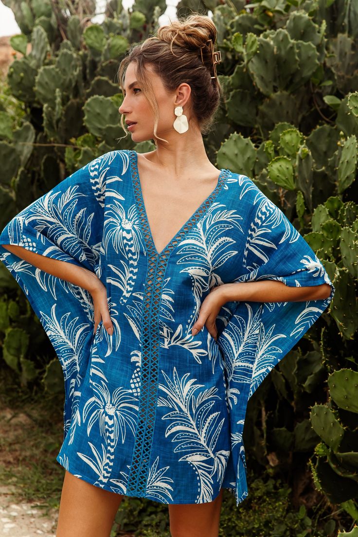 Introducing the Palmeiras Cover-Up: your ultimate companion for seaside sophistication and sun-soaked adventures. Inspired by the lush palms of Palmeiras, these cover-ups exude tropical allure with every sway. Crafted with meticulous attention to detail, the Palmeiras Cover-Up embodies both elegance and comfort. Its lightweight fabric gently drapes over your silhouette, offering a breezy feel that's perfect for beachside lounging or poolside relaxation. V-neck Tropical Print Beach Dress For Vacation, Tropical V-neck Swimwear With Tropical Print, Summer Tropical Print V-neck Swimwear, Tropical V-neck Swimwear For Beach Party, V-neck Tropical Print Swimwear For Vacation, V-neck Tropical Print Swimwear For Summer, Bohemian V-neck Swimwear For Beach, Tropical V-neck Beach Dress For Summer, Beachwear Swimwear With Palm Tree Print For Beach Season