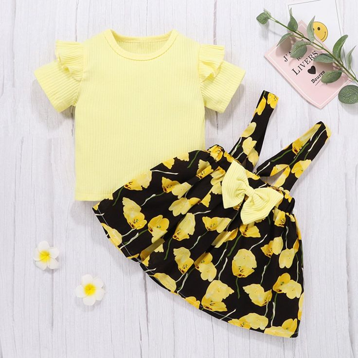 Size: 3-6 Months, 6-9 Months, 9-12 Months, 12-18 Months. Material: Cotton. Care: Machine Wash. Playful Yellow Sets For Spring, Casual Yellow Ruffled Sets, Cute Yellow Spring Sets, Yellow Sleeveless Sets For Playtime, Cute Yellow Sleeveless Sets, Playful Black Sets For Spring, Playful Black Spring Sets, Ruffle Outfit, Dress Pant Suit