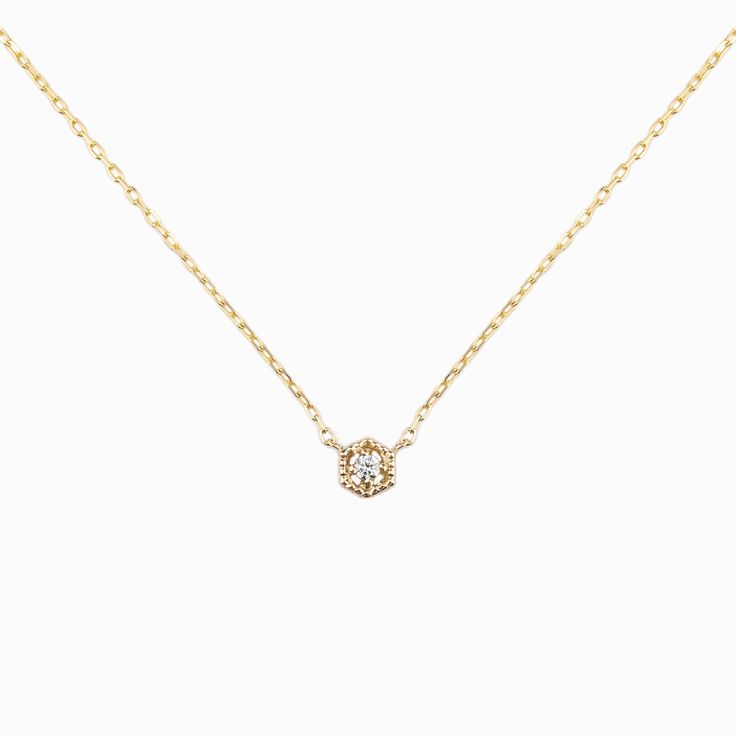 Vintage-style hexagon frame holds the center diamond with four prongs. The setting is hallowed and has a milgrain finish all around. This necklace is available in 2mm or 3mm diamonds. Hexagon width: 4.5mm for 2mm diamond, 6.0mm for 3mm diamond. Diamond weight: 0.03ct for 2mm, 0.10ct for 3mm Diamond quality: G color SI clarity Solid gold diamond cut chain 16 inches. Solid gold spring ring clasp closure Made of recycled solid 14k yellow gold, rose gold, white gold. Packaged in a recyclable kraft j Hexagon Diamond, Rose Gold White, Name Jewelry, Engraved Items, Diamond Cut, Spring Rings, Gold Rose, Gold Diamond, Solid Gold