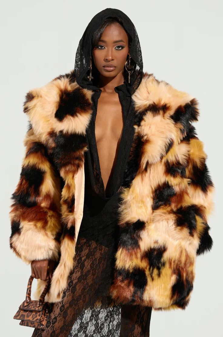 Take a walk on the wild side in The AKIRA Label Oversized Fur Coat. This fabulous coat is crafted from realistic, lux faux fur and features an oversized silhouette, a wide fold-over collar, long sleeves, spacious side seam pockets, a silky, satin-lined interior, and a hook and eye front closure. Style with a leather d Oversized Fur Coat, Cave Girl, Knee High Stiletto Boots, Exotic Fashion, Walk On The Wild Side, Stiletto Boots, Oversized Silhouette, Leather Dress, Hook And Eye