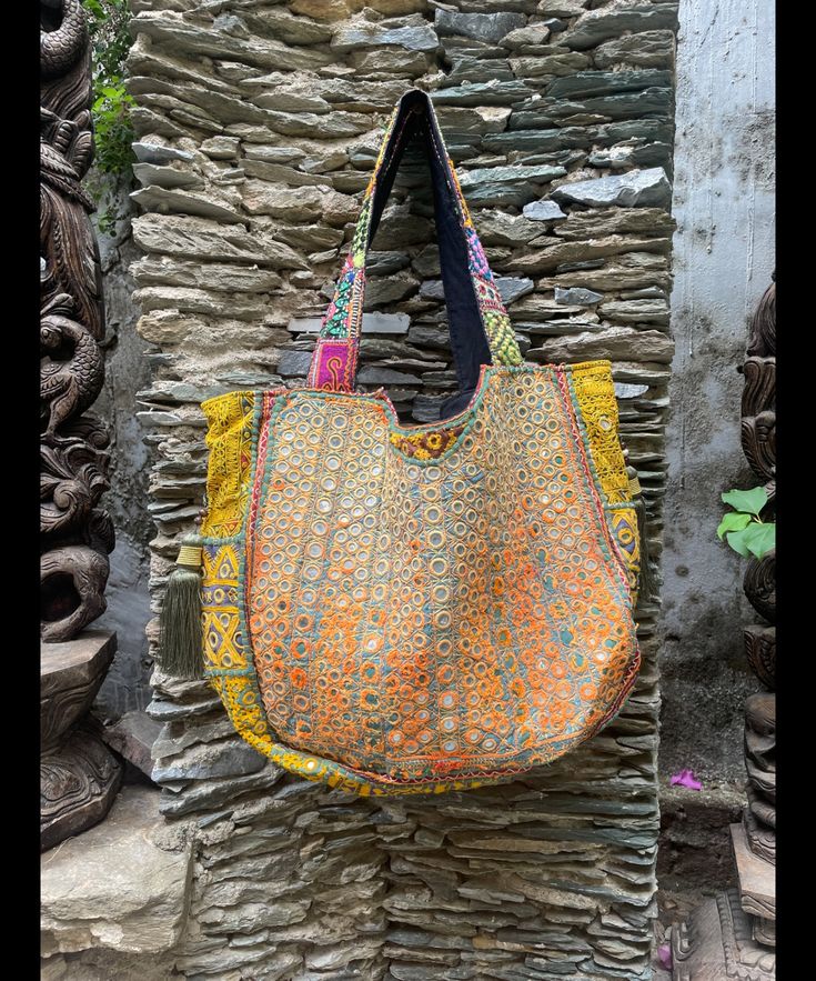 About bag  Indo-gypsy fusion, everyday use hand bag made from Banjara fabrics sourced from Vintage tribal costumes of regions of Rajastan and Gujarat. These are embellished with light catching coins, and intricate bead work tassels. Size - length 15 inches/ width 21 inches Company details:  Company name: Houseoftextile  Contact number: +919784447473  Email id: houseoftextile77@gmail.com  Shipping & custom : Delivery through one of the finest service providers : Skyway, Fedex, UPS  And DHL. Any l Email Id, Gmail Com, Hand Bag, Bag Making, Bead Work, Ups, Electronic Accessories, Tote Bag, Purses And Bags