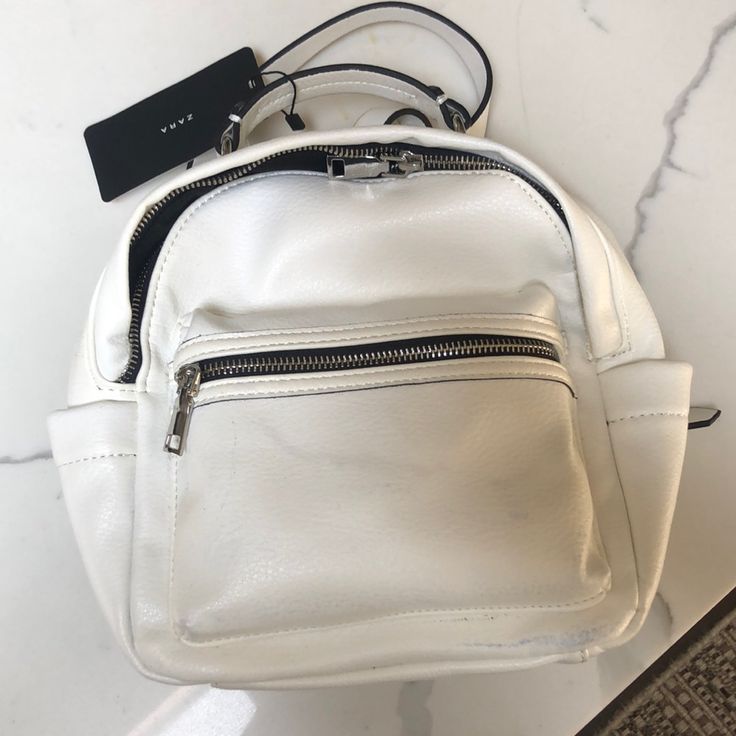 Brand New Never Used Zara White Backpack With Tags Casual White Leather Backpack, Trendy Zara Bags For On-the-go, White Casual Leather Backpack With Zipper Closure, White Casual Leather Backpack With Zipper, Casual White Leather Backpack With Zipper Closure, Casual White Leather Backpack With Zipper, White Summer Backpack With Adjustable Strap, Summer White Backpack With Adjustable Strap, Summer Backpack With Adjustable Strap In White