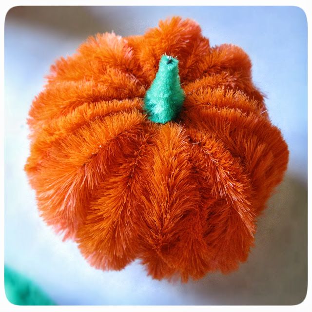 an orange stuffed pumpkin with a green leaf on top