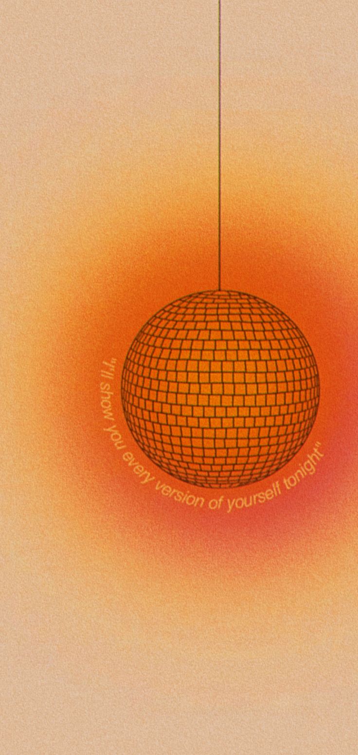 an orange and yellow background with a round object in the center that has words written on it