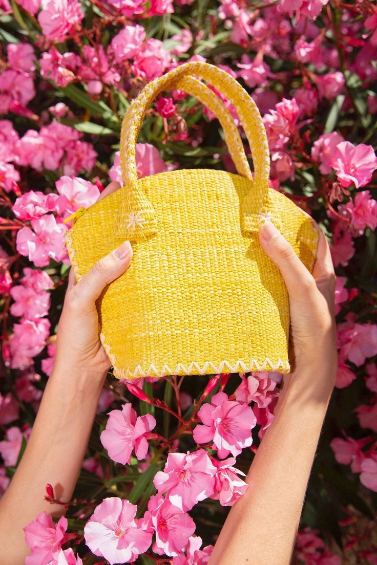 Natural and yellow raffia bag. The Gigi is your best ally for all occasions ! As a beach bag, a city basket or an evening purse to dress up your outfit, the Gigi is fit for all occasions and for all women. This trendy raffia bag is handmade in the purest tradition of raffia weaving. Carry by hand or at the shoulder, it is therefore the perfect fashion accessory ! But that's not all ! The Gigi aims to embellish your daily life every season with positivity and kindness throughout lithotherapy. Tha Raffia Weaving, Evening Purse, Raffia Bag, The Pure, Quartz Rose, Natural Red, Beach Bag, Daily Life, Straw Bag