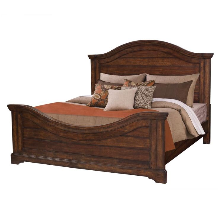 a wooden bed with pillows and blankets on it's headboard, against a white background