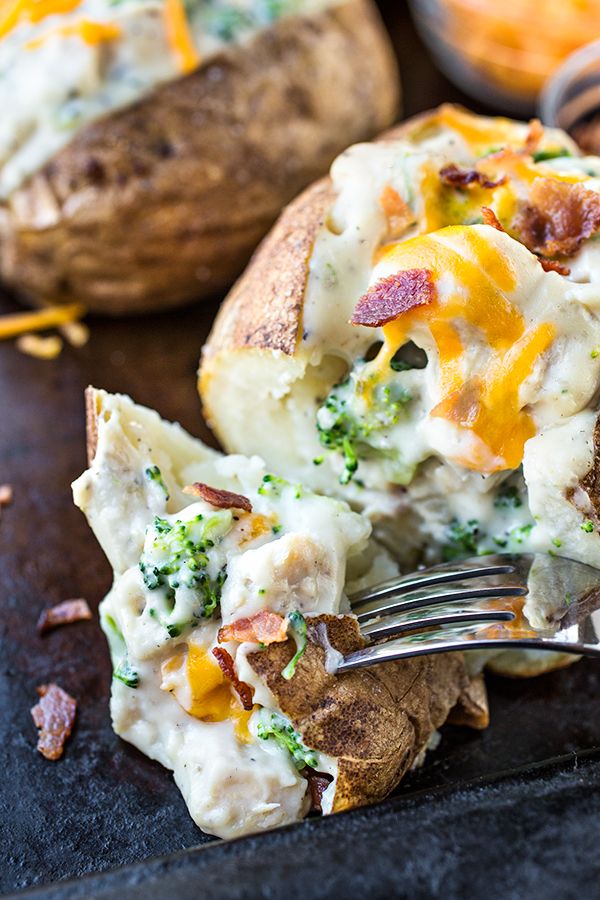 a close up of a plate of food with broccoli and cheese on it