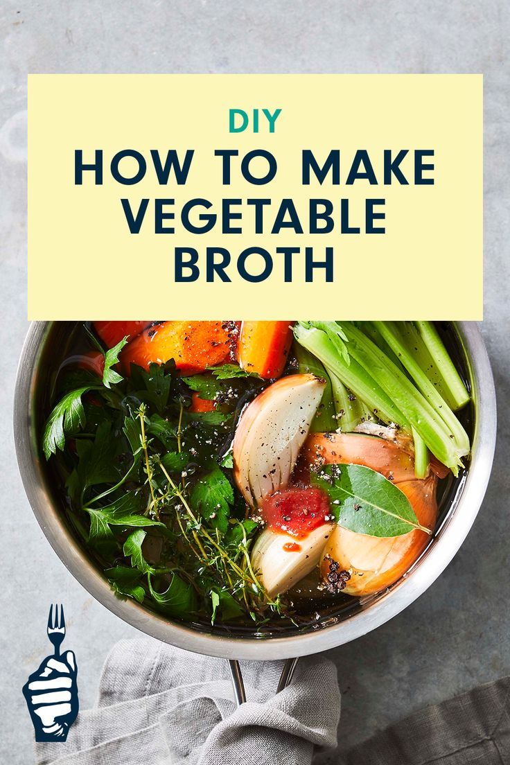 a bowl filled with vegetables and broccoli on top of a table