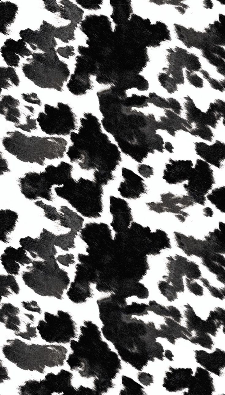 an animal print pattern is shown in black and white, as well as dark spots