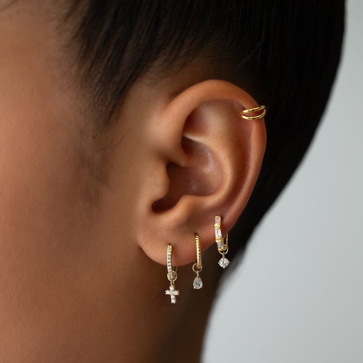 Adorn your favorite hoops with a touch of sparkle to your everyday look. Mix and match your ear-stack with tiny charms to get even more out of your staple hoops. Swap it out any time for an entirely new look. 14K Gold CZ crystals DOES NOT FIT ALL EARRINGS, shop all matching earrings / singles Jumpring Inner Diameter 2.2mm Cross height: 0.25in(6mm) #CS054 Double Hoop Earring, Tiny Charms, Earring Charm, Double Hoop Earrings, Flat Back Earrings, Moms Bracelet, Choker Pendant, Yellow Gemstones, Studded Necklace