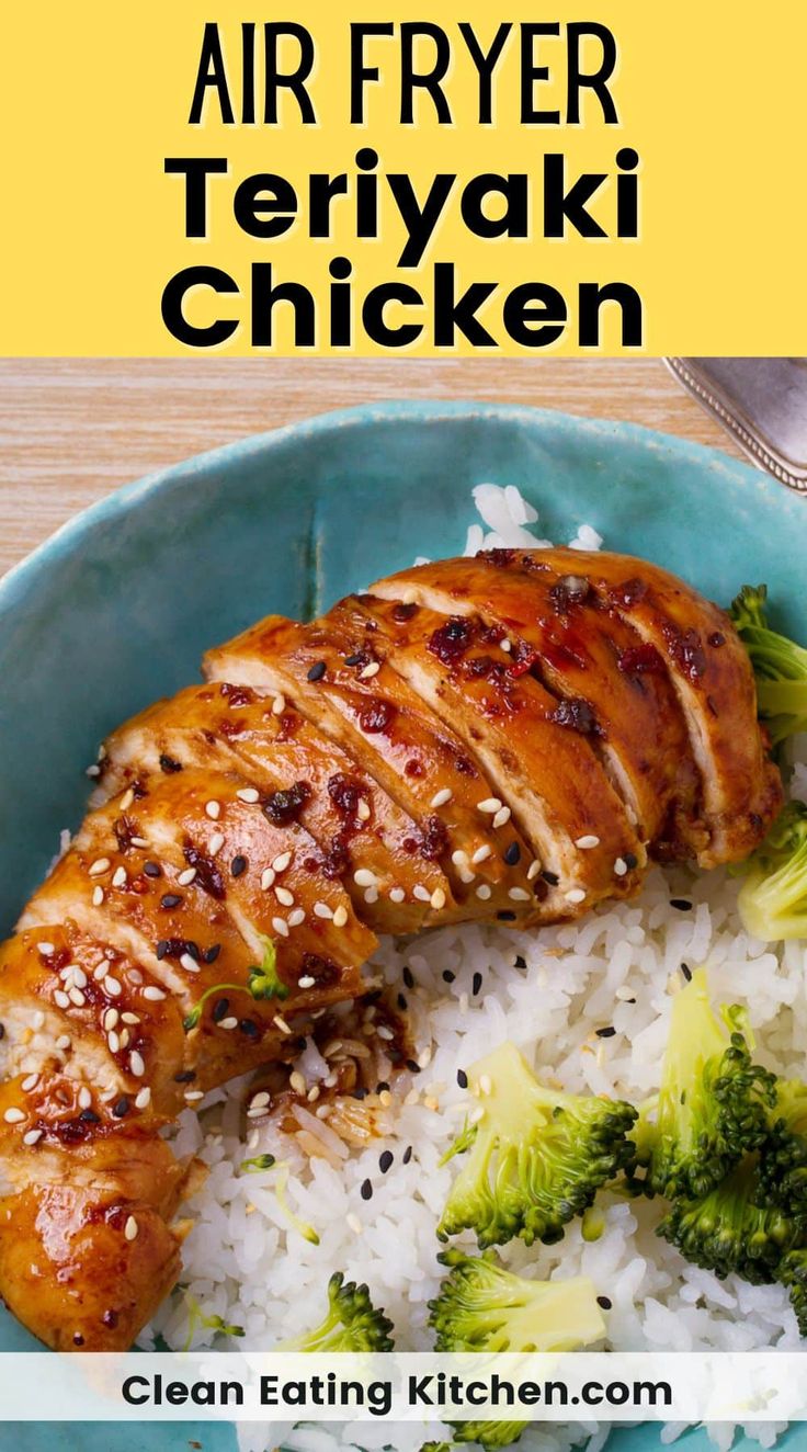 a blue bowl filled with rice and broccoli covered in teriyaki chicken