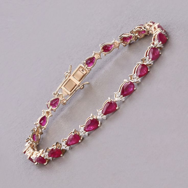 14k Gold Ruby Bracelet, July Birthstone Bracelet, Genuine Ruby and Diamond Yellow Gold Bracelet for Women, Ruby Tennis Bracelet Elevate your style with this luxurious 8.40 carat genuine pear ruby tennis bracelet. Set in 14K yellow gold and enhanced with 0.50 carats of genuine round white diamonds, this piece is a beautiful celebration of July's birthstone. Perfect for adding a touch of elegance to any ensemble. Product Details:  14K Yellow Gold Item Type: Bracelet Gross Wt: 10.42 Gemstone Wt: 8.40 ctw Diamond Wt: 0.50 ctw Total Stone Wt: 8.90 ctw Finish: Fine Finish Product Style: Tennis Bracelet Chain Type: No Chain Type Clasp: Box With Tongue And Safety Clasps Total Qty Of Stones: 84 Height: 4.06 MM Width: 4.83 MM Length: 7.00 Inches Primary Stone Color: Red Birthstone Month: July Gender Luxury Red Bracelets For Anniversary, Gold Ruby Bracelet, Red Diamond Bracelet, Gemstone Accented Fine Jewelry Tennis Bracelet, Diamond Bracelets With Gemstone Accents For Anniversary, Fine Jewelry Bracelets With Gemstone Accents And Cubic Zirconia, Anniversary Bracelet With Gemstone Accents, Anniversary Gemstone Accents Bracelets In Fine Jewelry Style, Anniversary Fine Jewelry Bracelets With Gemstone Accents