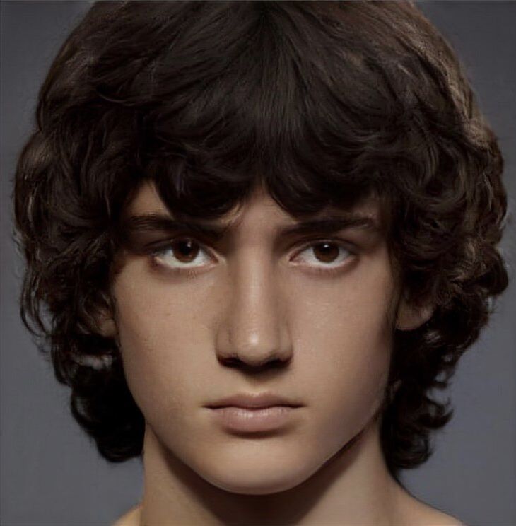 a close up of a mannequin's head with dark hair and eyes