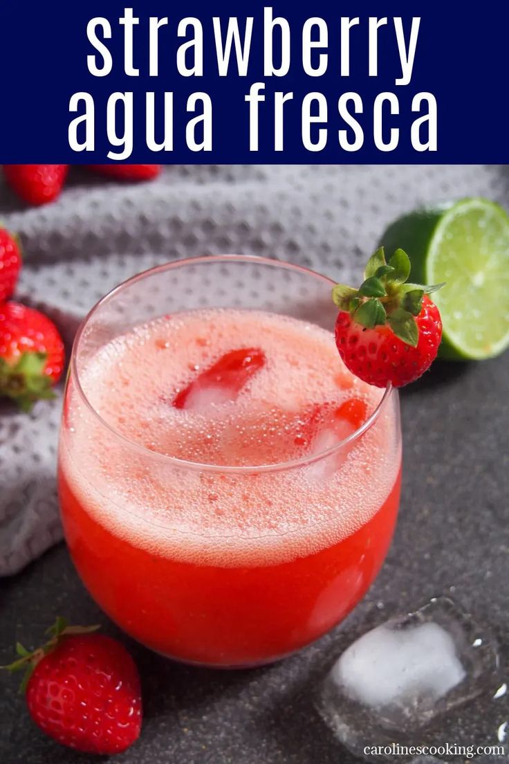 a strawberry agua fresca is garnished with fresh strawberries