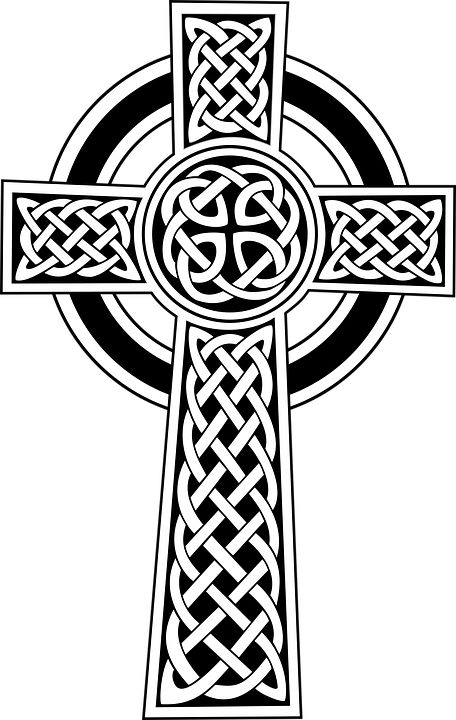 a celtic cross with an intricate design on it's side, in black and white