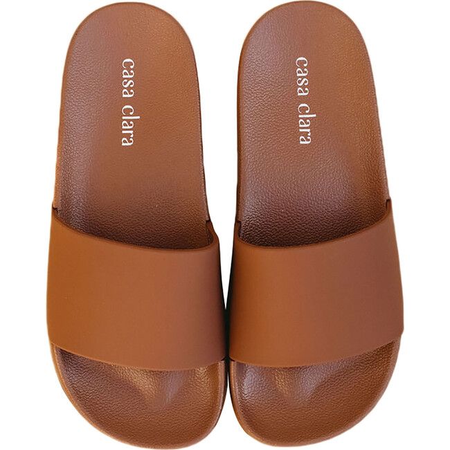 Get out of the slippers and get into the Tommy streamlined pool slides. Tommy is the best beach buddy, next to sunscreen. With a streamline single strap, and monochromatic style, Tommy is meant for casual beach days, pool strolls, and lake visits. - monochromatic single strap pool slide - 100% EVA rubber Small: 6-7 Medium: 7-8 Large: 8-9 | Casa Clara | Women's Tommy Slide Shoes, Terracotta (Brown, Size Large)  |  Maisonette collects the best children’s products from around the world (unlike Zuli Brown Non-slip Slides For The Beach, Brown Summer Slides For Beach, Brown Slide Flip Flops For The Beach, Brown Slip-on Slides For Vacation, Beach Slip-ons Synthetic, Brown Slide Flip Flops With Cushioned Footbed, Brown Slide Flip Flops For Summer, Brown Synthetic Beach Slippers, Brown Slides With Rubber Sole For Vacation