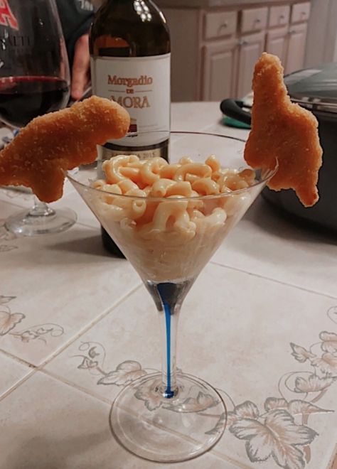 a martini glass filled with macaroni and cheese