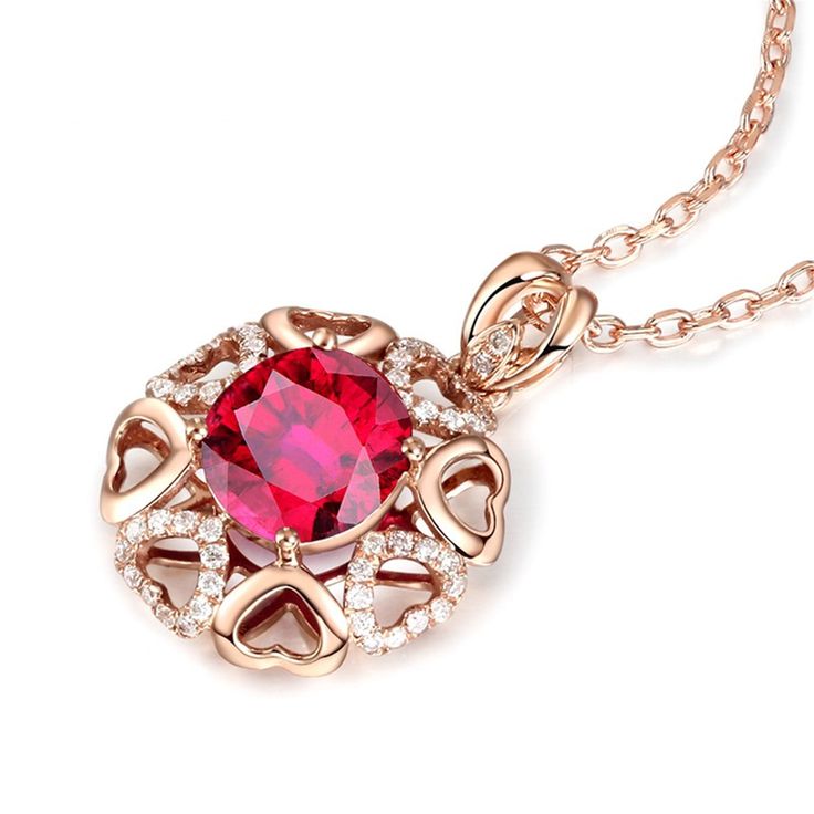 A ring of glittering and gleaming hearts surrounds a vibrant red crystal on this lovely pendant necklace, making it an eye-catching accent for a variety of ensembles. Chain: 17.7'' L Pendant: 0.79'' W x 0.79'' H Lobster claw clasp 18k rose gold-plated copper / crystal / cubic zirconia Valentine's Day Party Heart Necklace In Cubic Zirconia, Red Round Jewelry For Valentine's Day, Red Cubic Zirconia Birthstone Jewelry, Valentine's Day Crystal Necklace, Dazzling Ruby Necklace For Gift, Red Lab-created Ruby Necklace As Gift, Gift Red Lab-created Ruby Necklace, Sparkling Stone Necklaces For Valentine's Day Gift, Red Lab-created Ruby Necklace For Gift