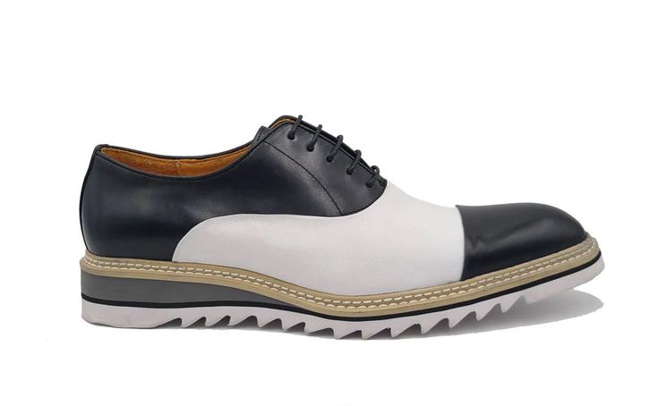 Leather Spectator Lace-Up Oxford Black/White Gorgeous lace-up Oxford from the Carrucci Collection in Smooth leather features a Cap-Toe, Double Stitched welt and a Tri Color Lightweight Rubber Sole! White Lace-up Oxfords For Office, White Wingtip Lace-up Shoes For Work, White Brogue Lace-up Shoes For Work, White Leather Sole Lace-up Shoes For Work, White Lace-up Work Shoes With Leather Sole, White Lace-up Shoes With Leather Sole For Work, White Cap Toe Oxfords For Spring, White Leather Lace-up Shoes For Office, White Brogue Lace-up Shoes For Derby