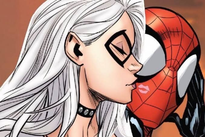 a woman with white hair and glasses kissing a spider man