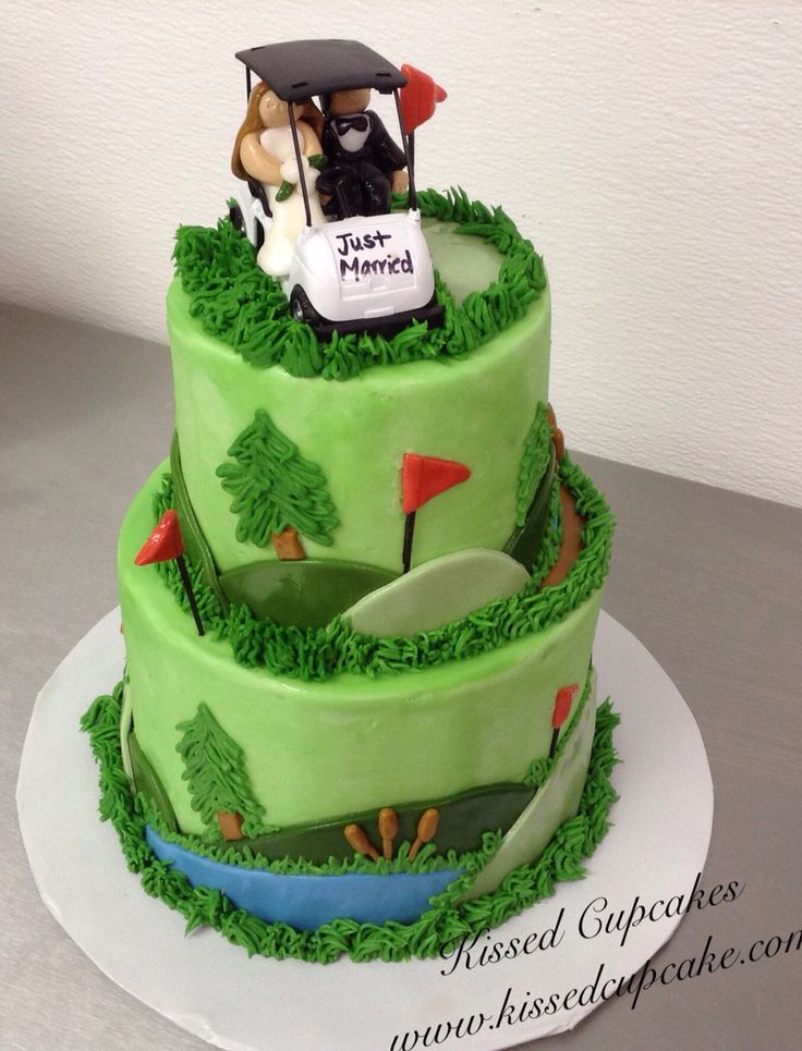 a three tiered cake decorated with green frosting and golf themed fondant decorations