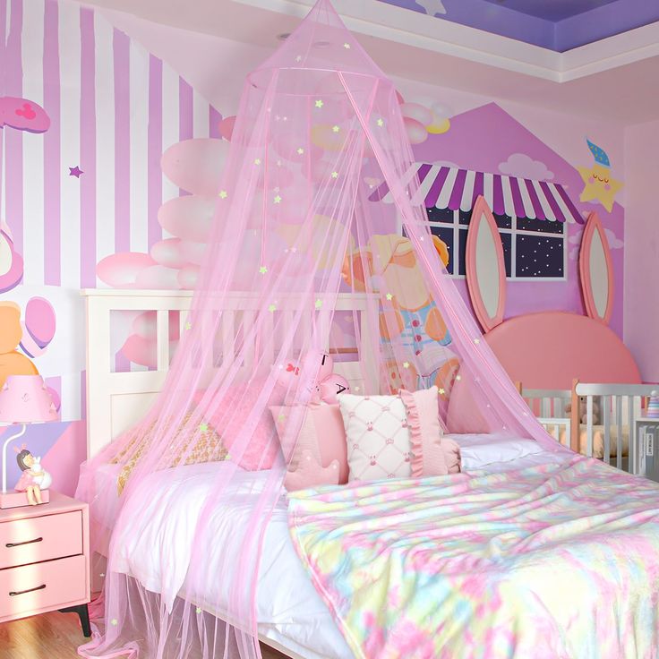 a child's bedroom decorated in pink and purple