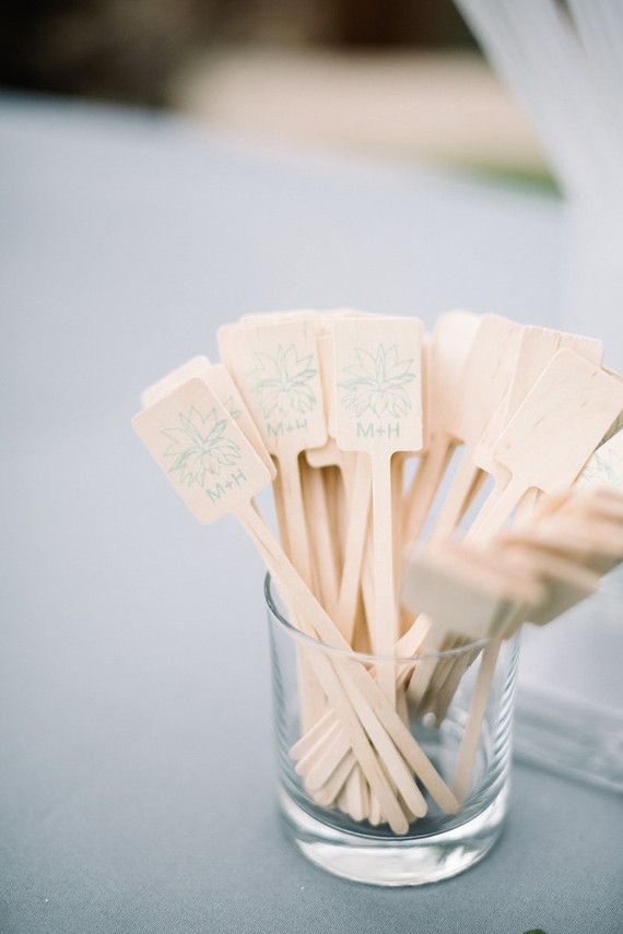 small wooden utensils in a glass on a table