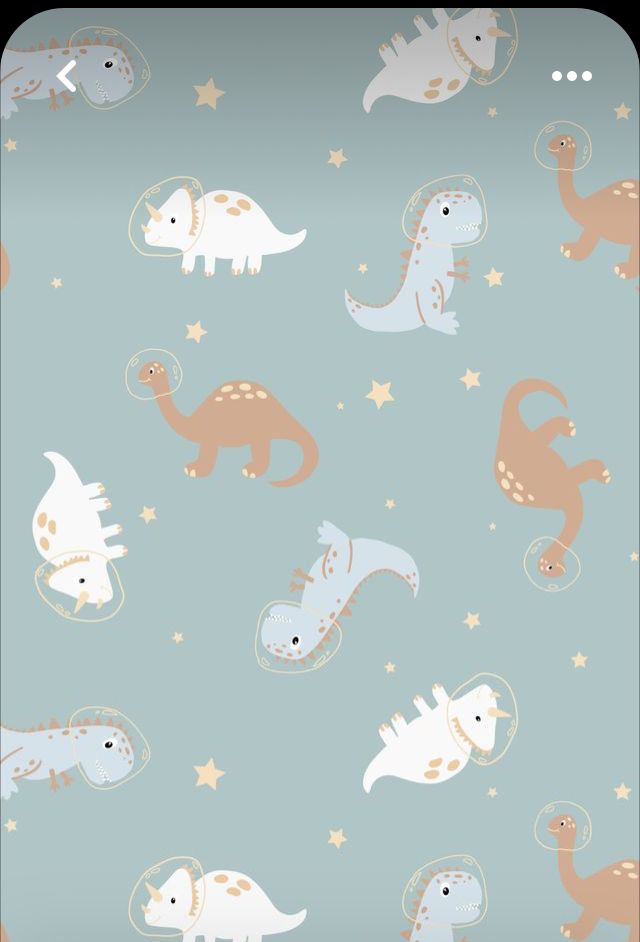 a blue background with dinosaurs and stars on it