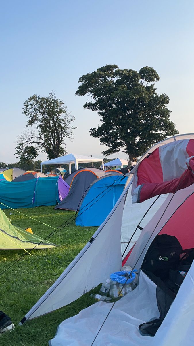 many tents are set up in the grass