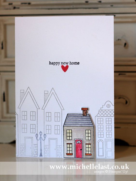 a handmade card with a house on it and the words happy new home written in red