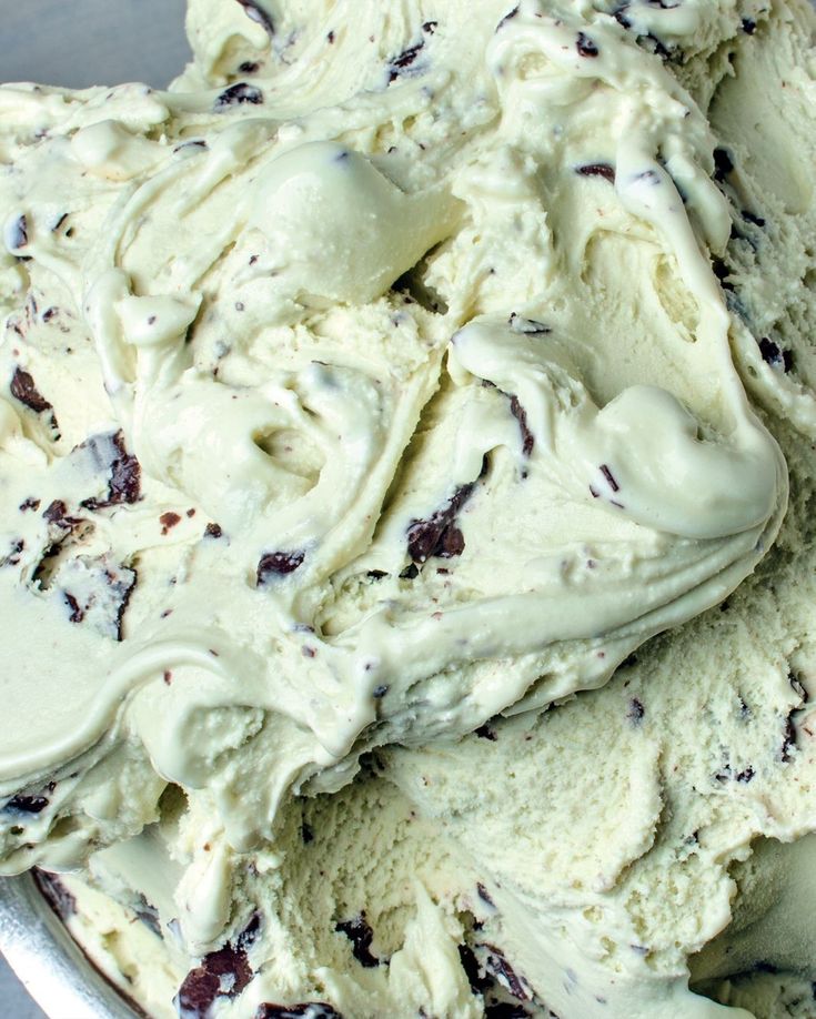 a bowl filled with ice cream sitting on top of a table