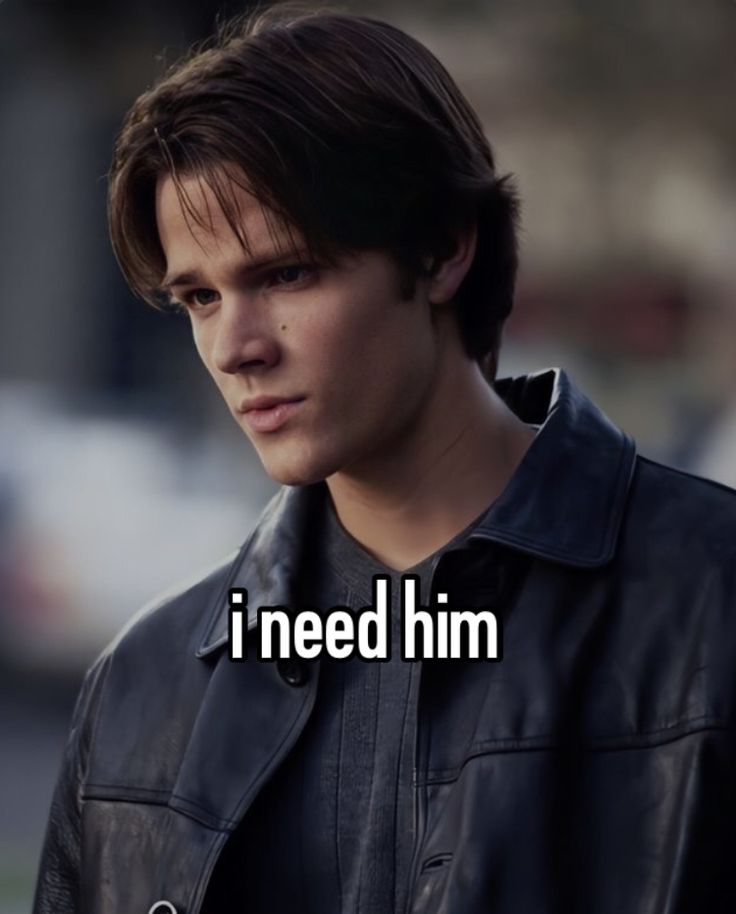 a young man wearing a leather jacket with the words i need him