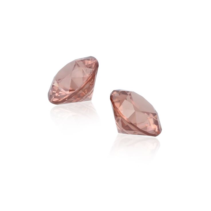 Petal-icious Pair. Zircon is a precious gem, not to be confused with cubic zirconium, which is an inexpensive diamond substitute. These perfectly matched round cuts are fantastic as the basis for a pair of earrings or cufflinks. The delicate rose-pink color is associated with romance by many metaphysical sources. The gentle pink shade is also believed to be helpful in developing self-esteem.Gemstone Details Identification: Natural Rose Zircon Carat: 6.80 Total Carats Shape: Round Color: Rose Mea Pink Shade, Precious Gems, Rose Pink, Pink Roses, Round Cut, Pink Color, Cufflinks, Wedding Rings, Gems