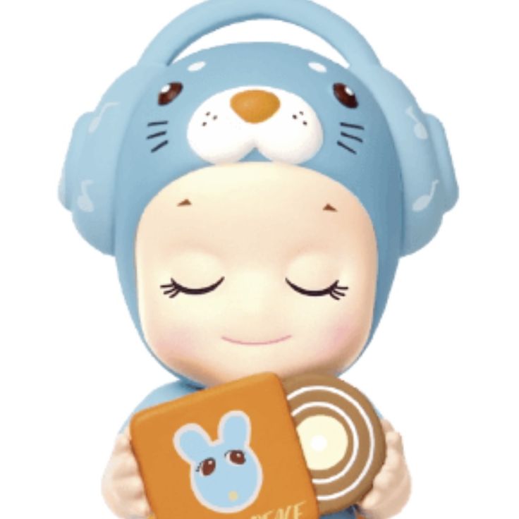 a small toy with headphones and a book in its hands, holding it up